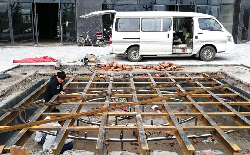 云南大姚兴亚华府大厦小型旱地音乐喷泉火热施工中